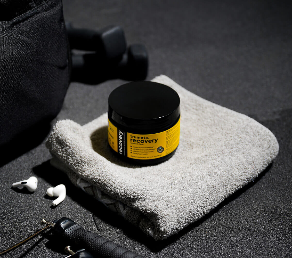 Recovery supplement with towel and dumbbell